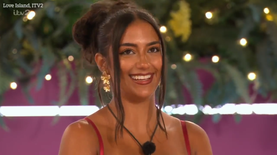 Smiling woman on Love Island.