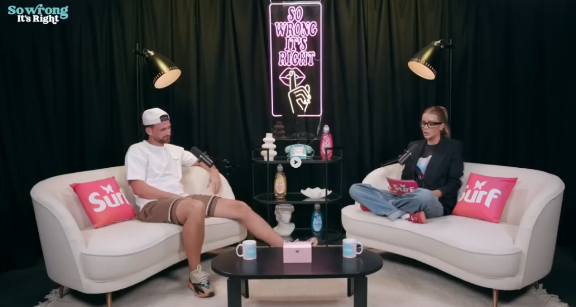 Two people sitting on sofas during a podcast recording.