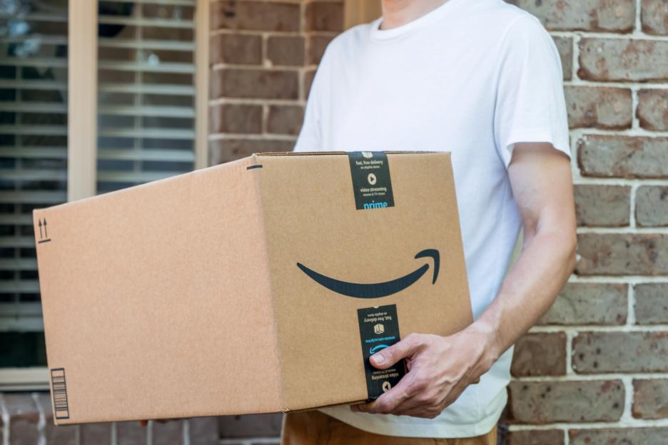 Person holding a large Amazon Prime package.