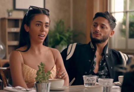 Ruby Adler and Reza from Made in Chelsea sitting at a table together.