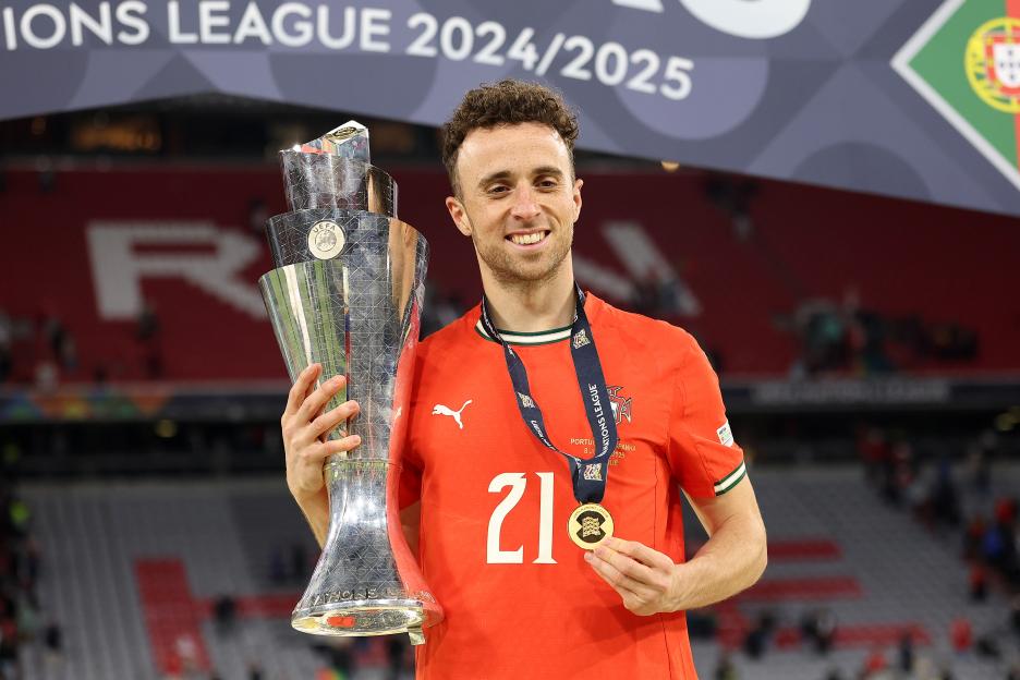 Diogo Jota of Portugal holding the UEFA Nations League trophy.