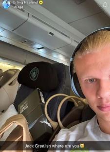 Erling Haaland on a plane, captioned