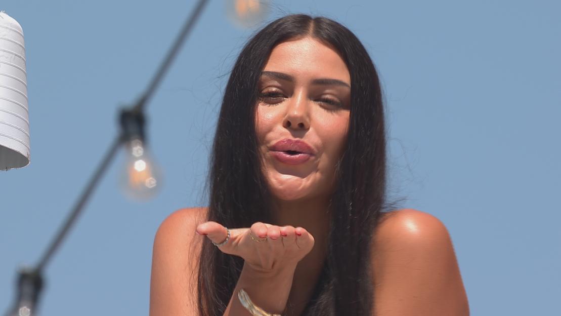 Woman blowing a kiss.