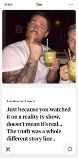 Photo of a man with a mustache, tattoos, and a friend, holding drinks.