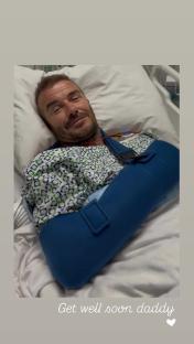 David Beckham in a hospital bed with his arm in a sling.
