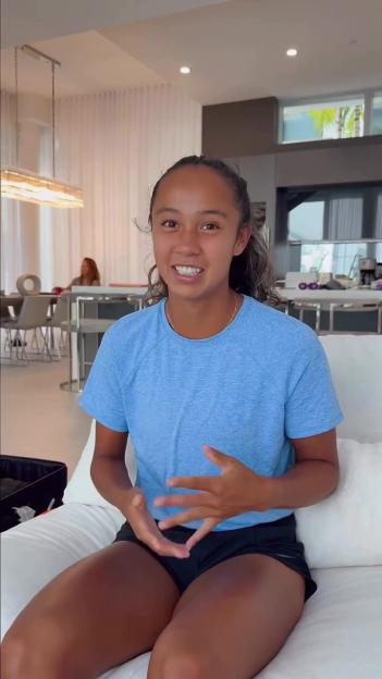 Leylah Fernandez sitting on a couch and talking.