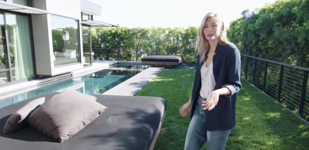 Maria Sharapova standing by her pool.