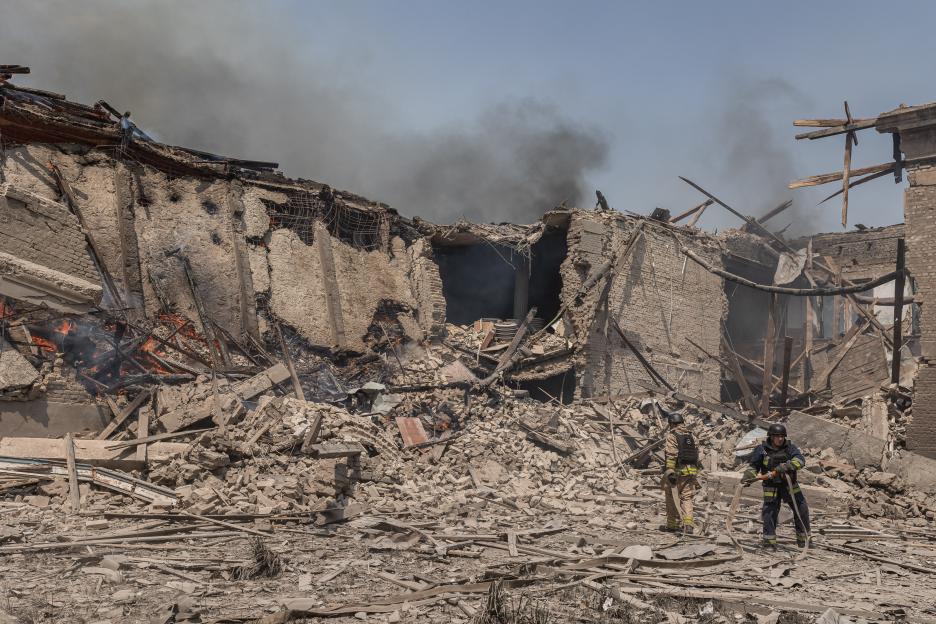 Firefighters at the site of a bombed-out school in Kostiantynivka, Ukraine.