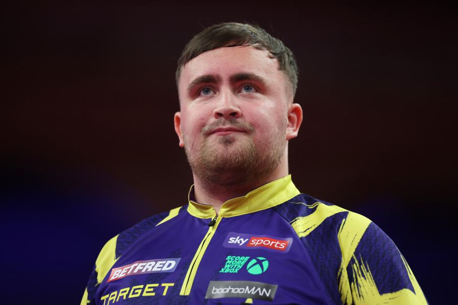 Luke Littler of England during a darts match.
