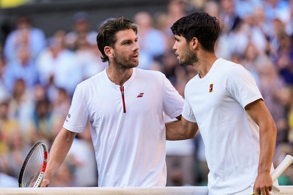 Carlos Alcaraz of Spain and Cameron Norrie of the United Kingdom at Wimbledon.