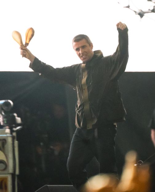 Liam Gallagher of Oasis performing on stage.