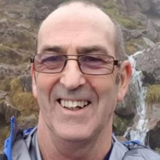 Close-up photo of David Brookfield, smiling.