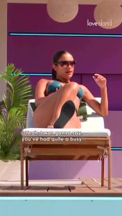 Screenshot of a Love Island contestant on a sun lounger by the pool.