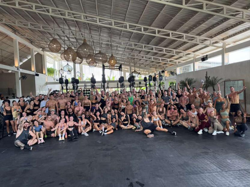 Large group photo of people in a gym.
