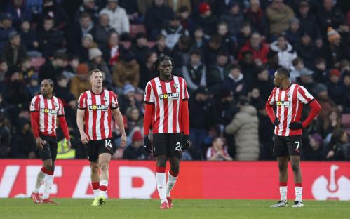Southampton players looking dejected on the pitch.