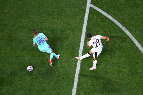Overhead view of a soccer player kicking the ball.