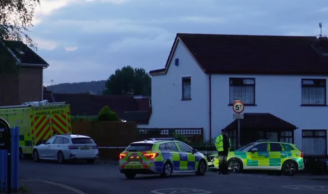 Emergency vehicles outside a house following a bomb scare.