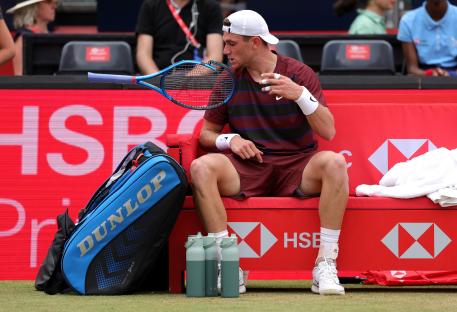 Jack Draper of Great Britain throws his broken tennis racket.
