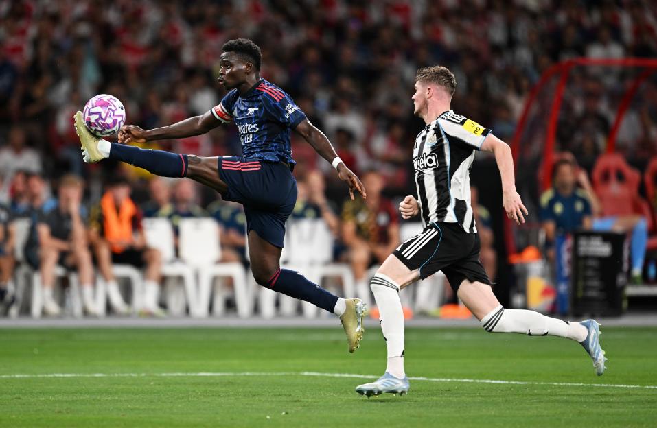 Bukayo Saka of Arsenal controls the ball during a soccer match.