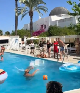 Person falling into a pool at a party.