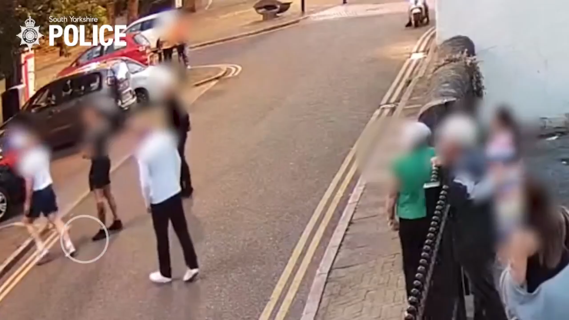 Surveillance footage of a pub brawl where a gunman opens fire.