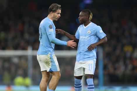 Jack Grealish and Jeremy Doku of Manchester City during a Champions League match.