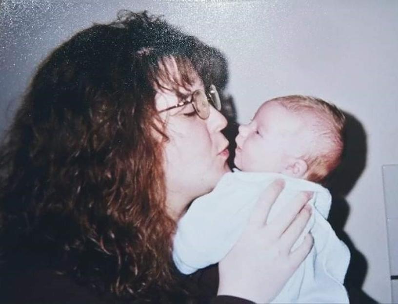 Woman kissing baby.