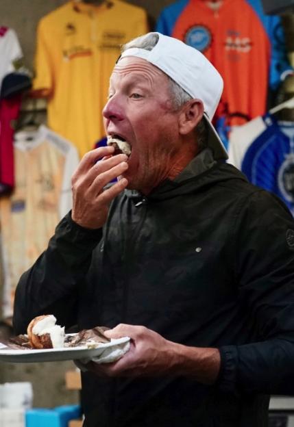 Man eating pastry.