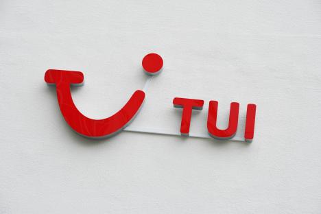 TUI logo on a wall.