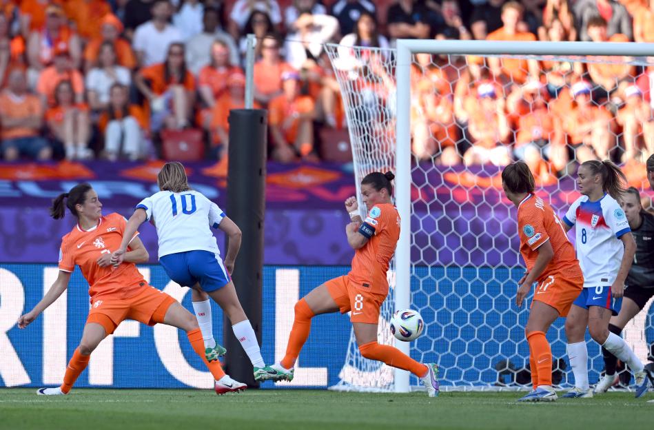 Ella Toone of England scoring a goal during a soccer match.