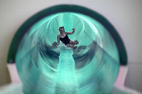 Woman going down a water slide.