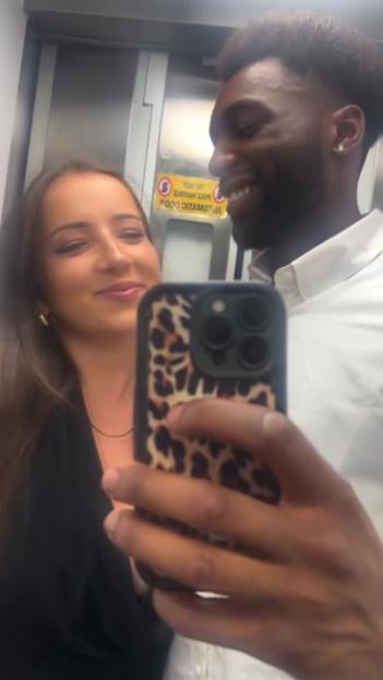 Selfie of a couple in an elevator.