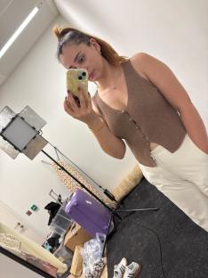Woman trying on children's clothing.