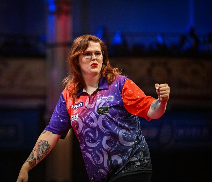 Noa-Lynn van Leuven celebrates winning a darts match.