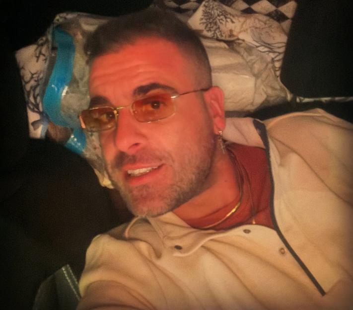 DJ Godzi, aka Michele Noschese, lying down.