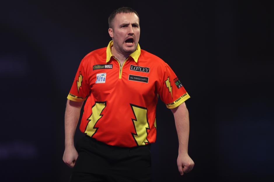 Matthew Edgar of England reacting during a darts match.