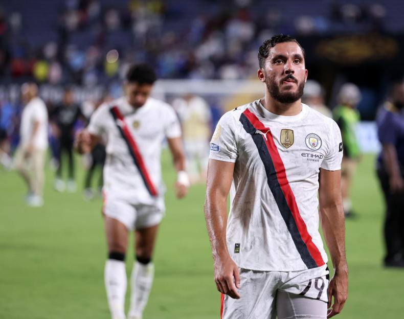Rayan Cherki of Manchester City looking dejected after a match.