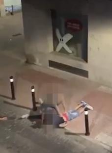 A person in a chokehold on the ground.