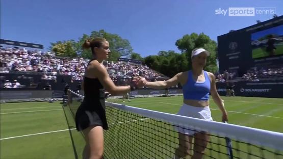 Maria Sakkari and Yulia Putintseva shaking hands at the net after a tennis match.