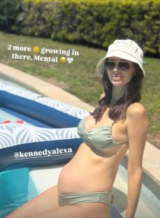 Pregnant woman in a sage green bikini by the pool.