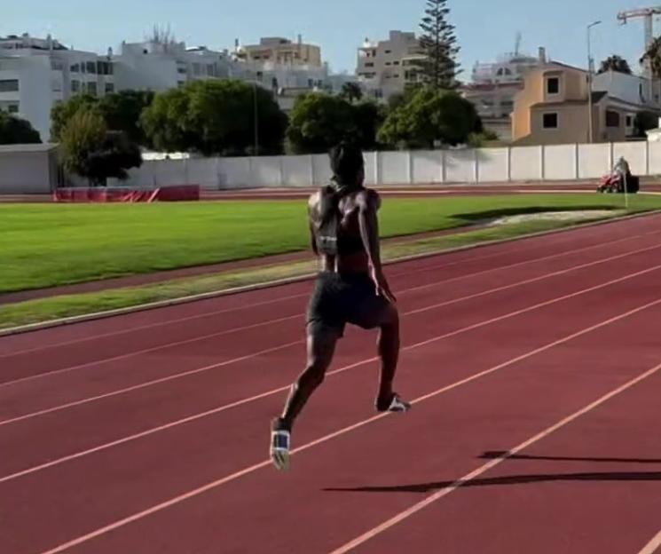 A runner sprinting on a track.