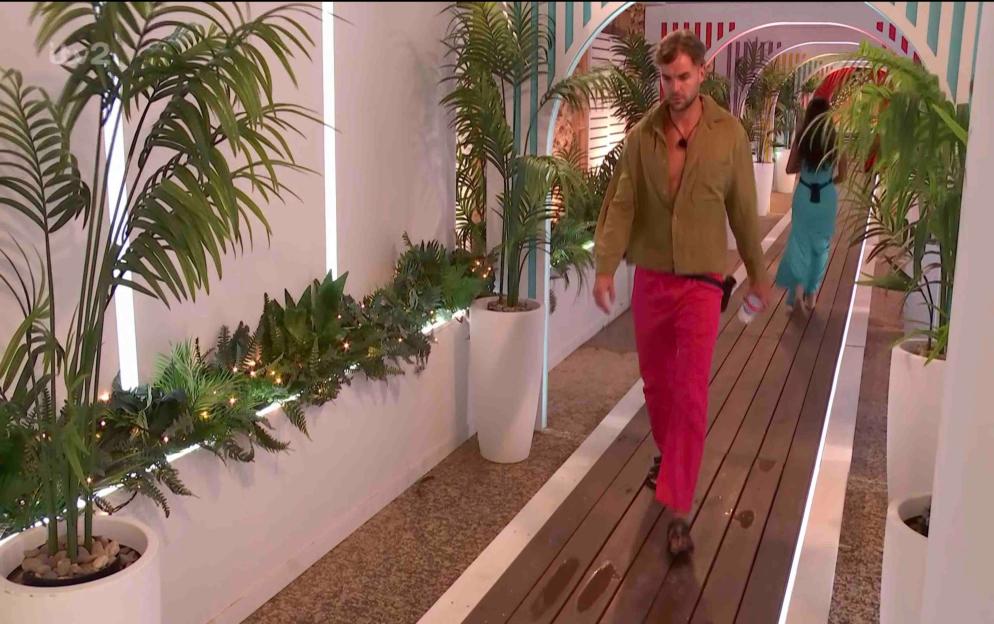 Harry walks away from Helena after a heated conversation.