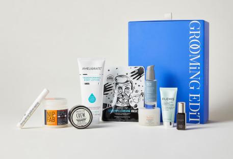 Grooming kit in a blue box with various skincare and grooming products.