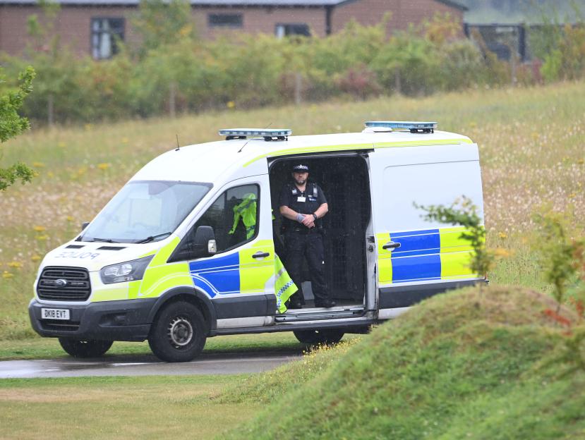 Police van at a search scene.