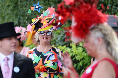 Woman wearing a colorful, star-shaped hat at Royal Ascot.