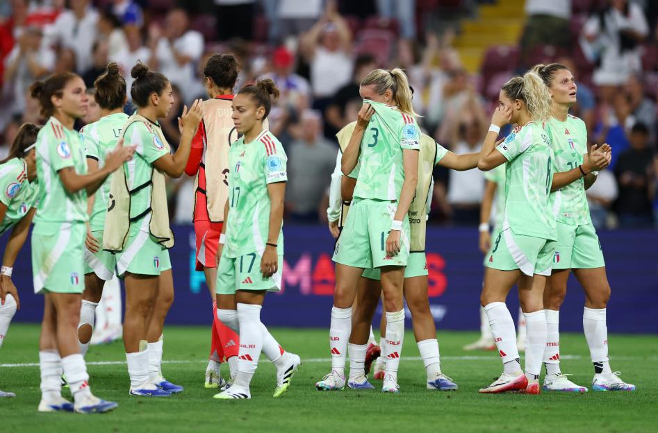 Italian women's soccer team looking dejected after a match.