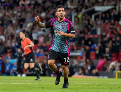 Carlos Tevez celebrating a goal at Soccer Aid for UNICEF.