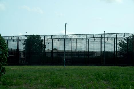High security fence surrounding a building.