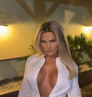 Woman in a low-cut white shirt.
