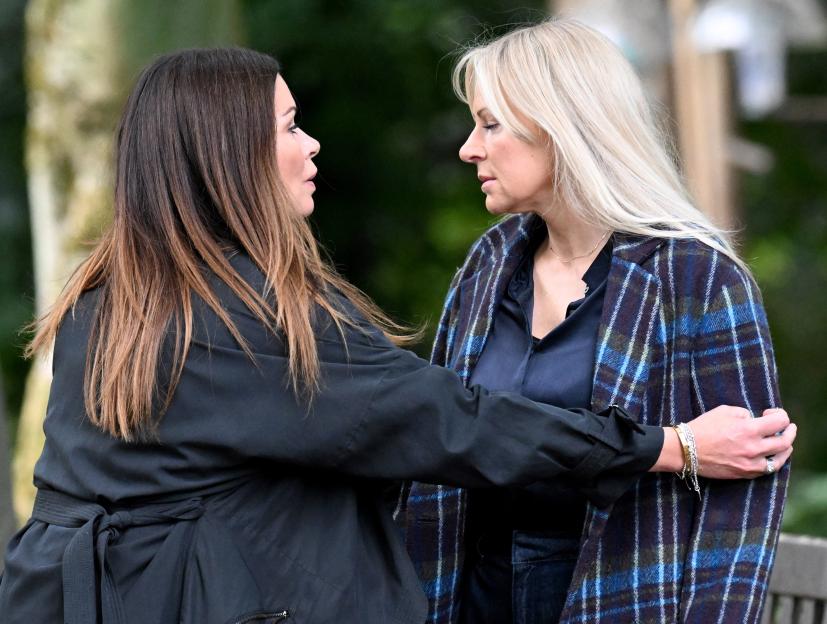 Alison King and Vicky Myers filming an emotional scene in a park.